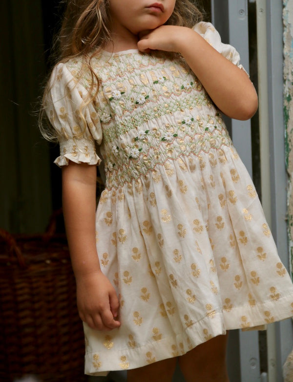 Long smocked blouse with golden flowers on ivory